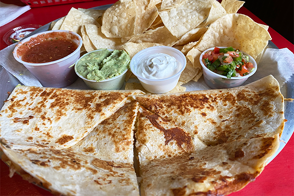 Quesadilla with several sauces and tortilla chips | 265 N Lumpkin St, Athens, GA 30601